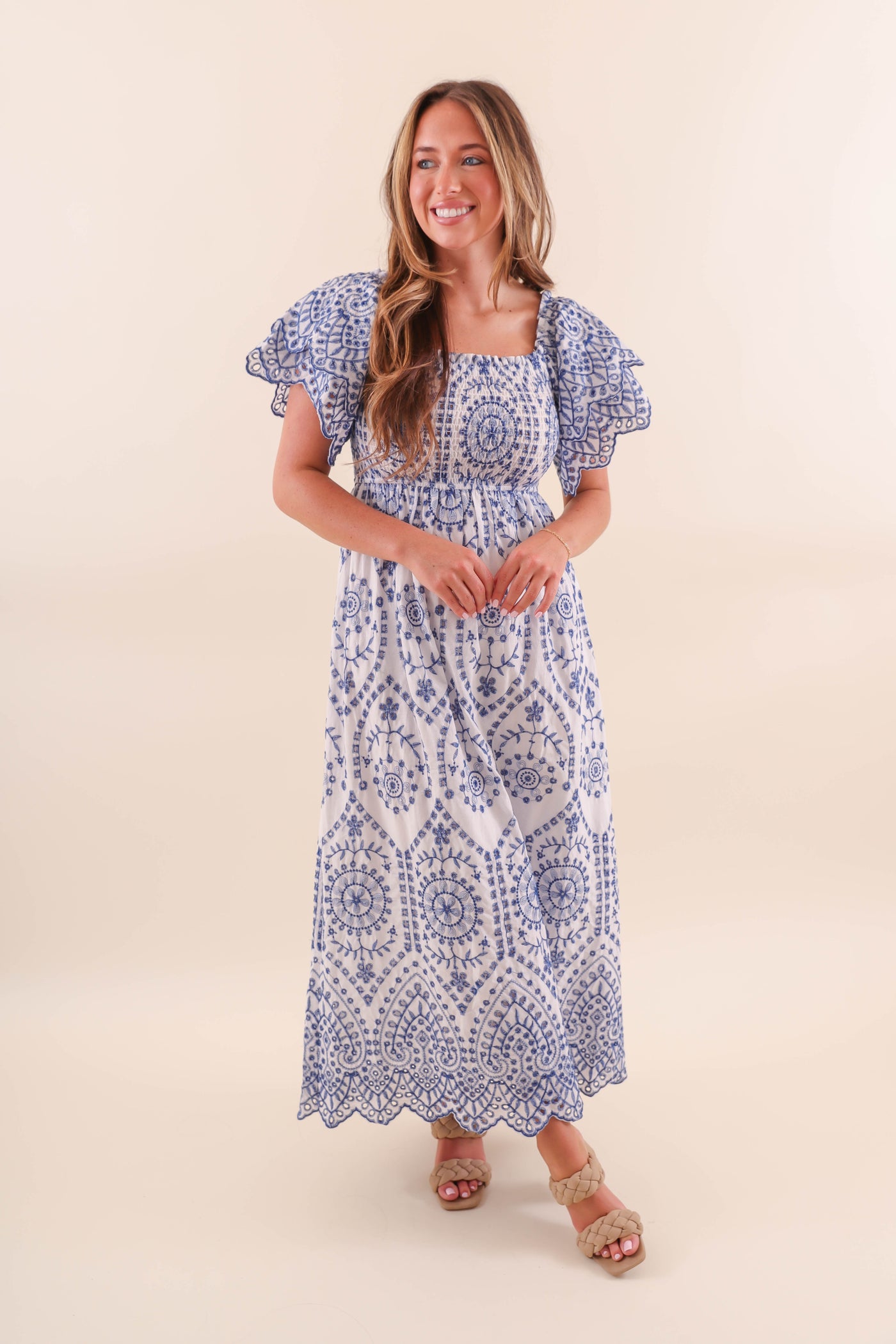 White maxi dress with blue embroidery