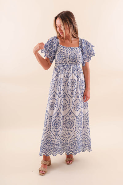 White maxi dress with blue embroidery